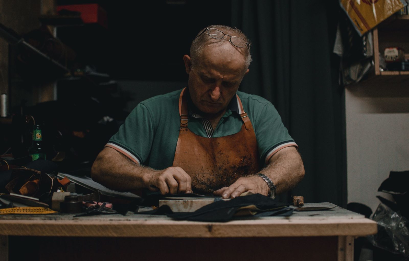 Hands binding a leather journal