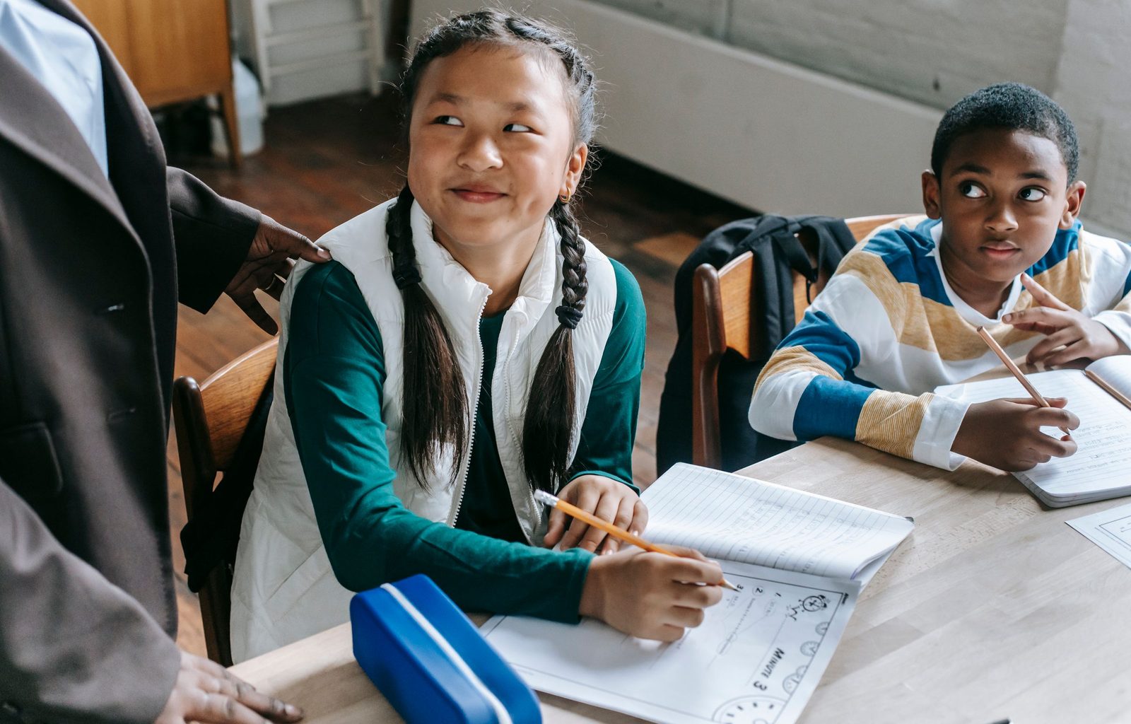 Tutor reading with a young student